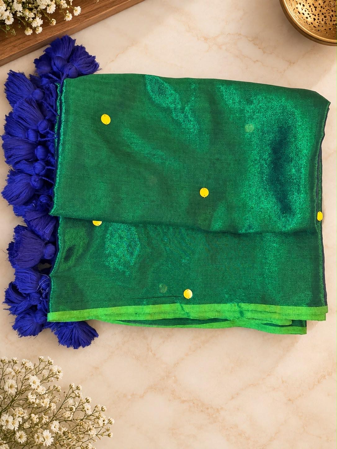 Green silk saree with traditional details